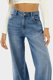 Wide-leg denim jeans in Dusty Blue with a subtle fade and button closure.