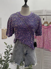 Purple crew neck t-shirt with iridescent sequins and short sleeves.