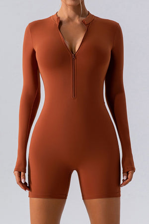 Sculpted performance romper in caramel with long sleeves and zip detail