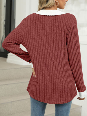 Ribbed knit long sleeve t-shirt in Rust Red with white collar and cuffs.