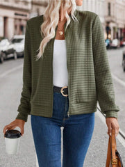 Army green quilted bomber jacket with zip closure and pockets.