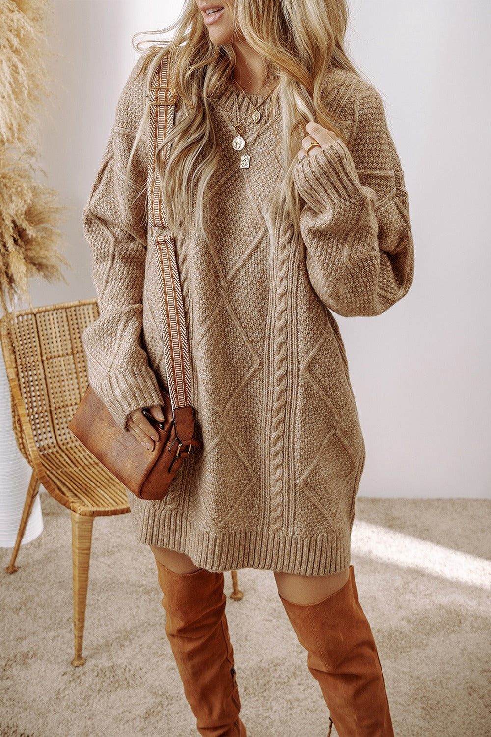 Tan cable knit sweater dress with diamond pattern and crew neck.