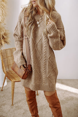 Tan cable knit sweater dress with diamond pattern and crew neck.