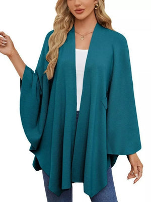 French blue knit cape top with draped elegance and wide sleeves
