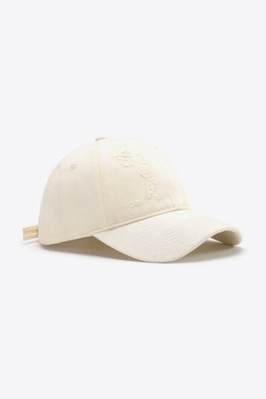 Cream baseball cap with distressed detail and adjustable strap