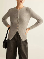 Grey ribbed knit cardigan with crew neck, gold buttons, and asymmetrical hem.