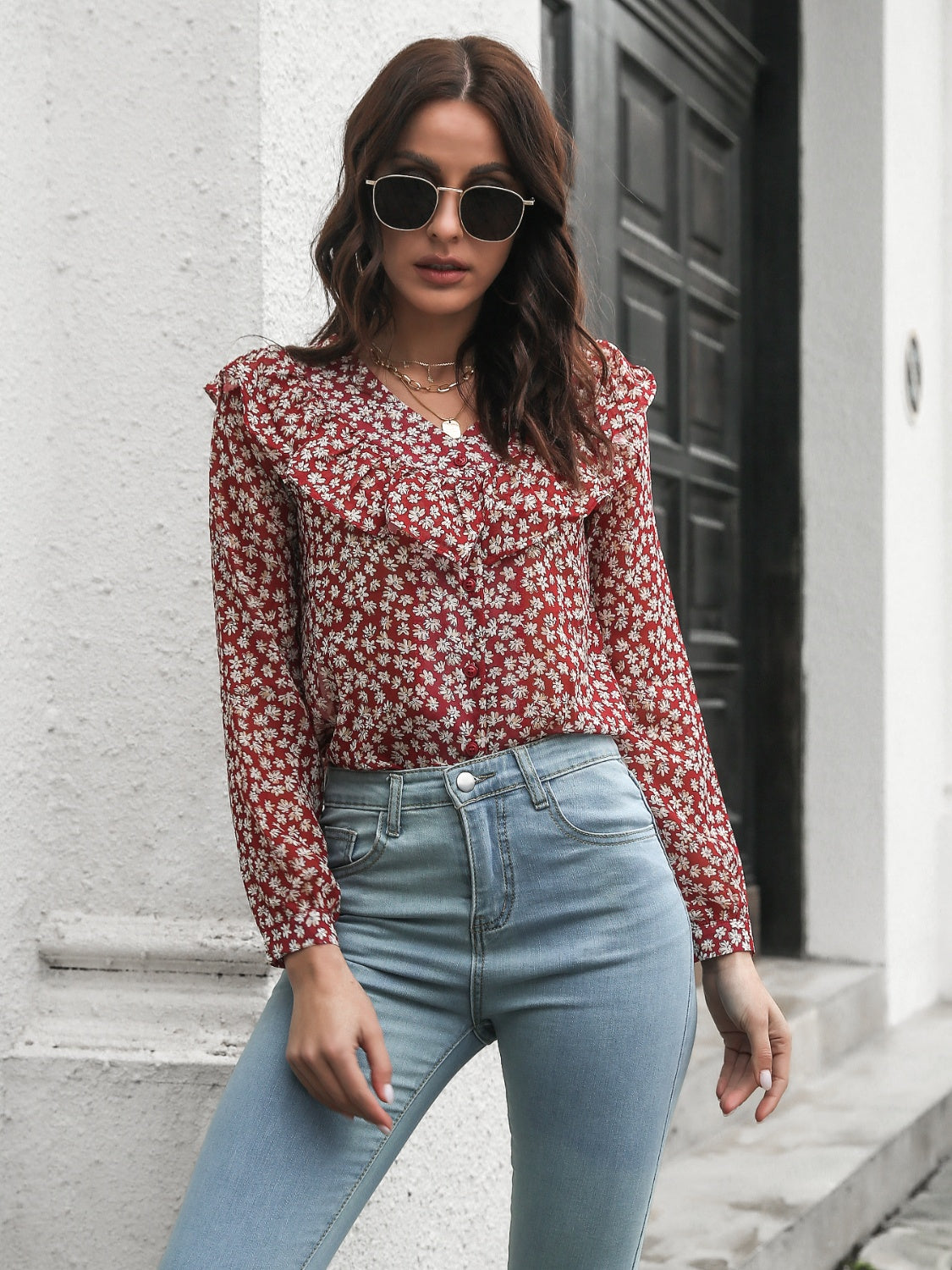 Floral ruffle trim blouse in deep red with a white floral pattern and button front.