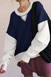 Chic Contrast Crewneck Sweatshirt in navy and white with contrast stitching and thumbholes.