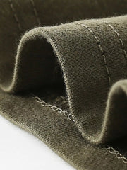 Toddler olive green cotton t-shirt detail showing crew neck stitching.