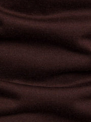 Brown cotton t-shirt with ribbed texture and asymmetric hem detail.