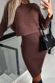 Chestnut ribbed knit midi dress with a cropped long-sleeve top, styled with a black handbag.