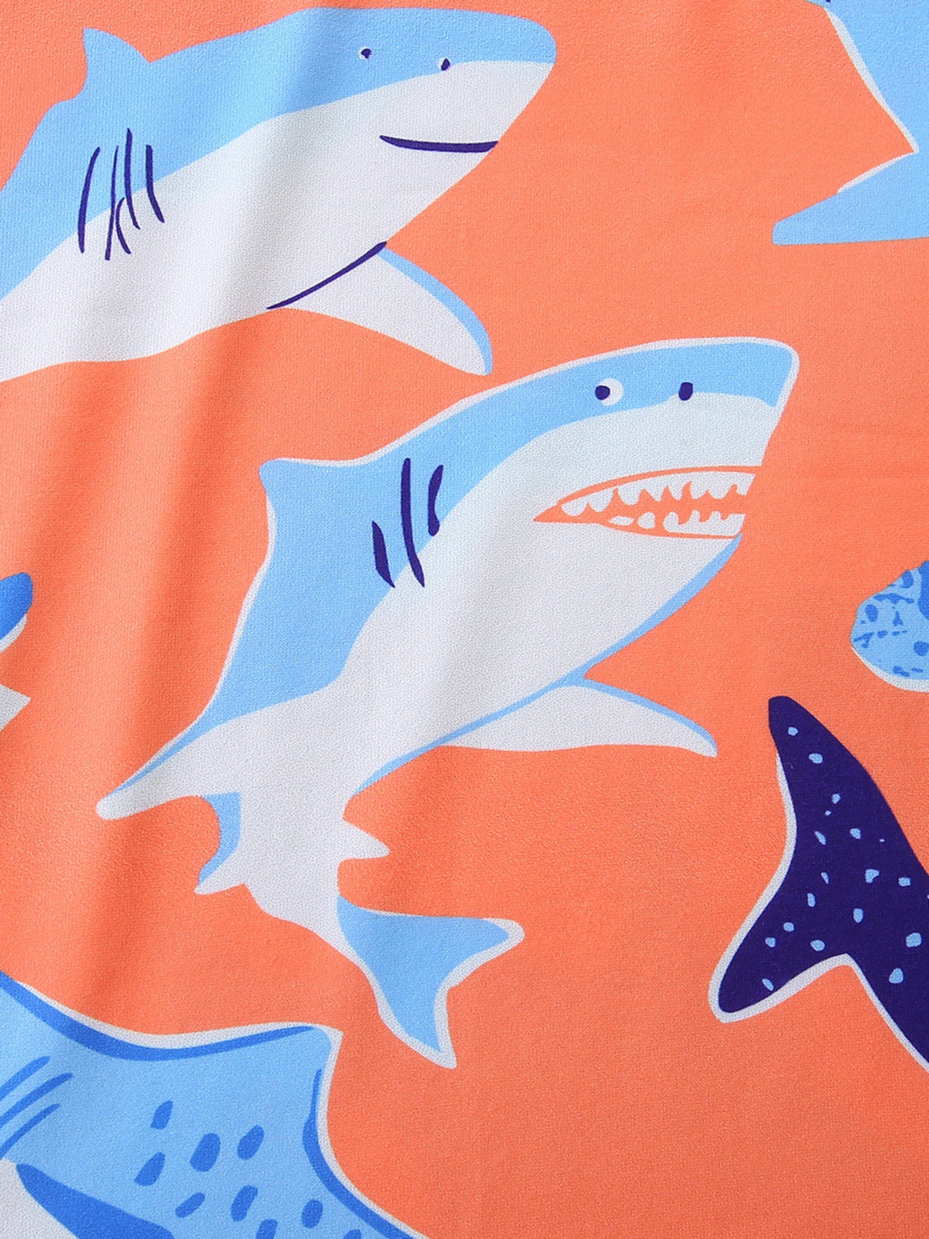 Toddler boys' underwear set with a playful shark print on an orange background.
