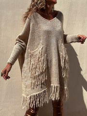 Camel knit poncho sweater with fringe pockets and hem, V-neck, long sleeves.