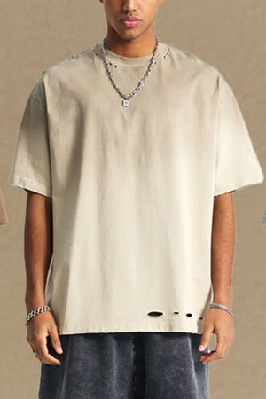 Taupe oversized t-shirt with distressed hemline and neckline details.