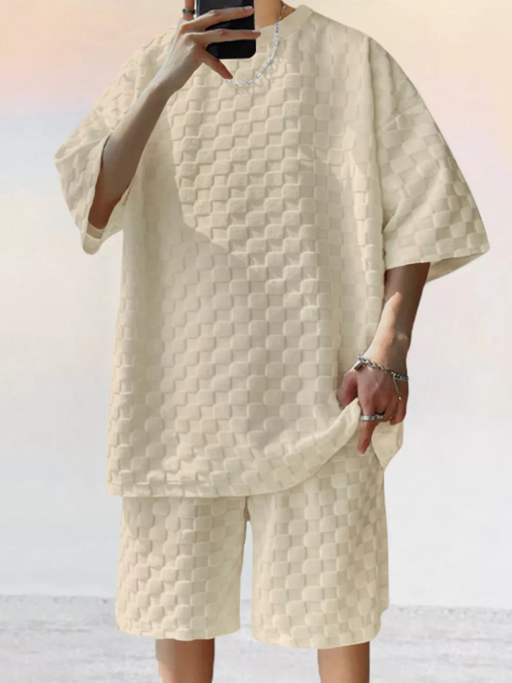 Textured casual two-piece set in cream with checkerboard pattern.