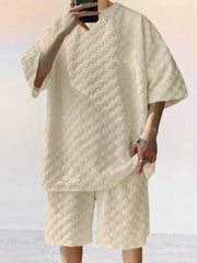 Textured casual two-piece set in cream with checkerboard pattern.