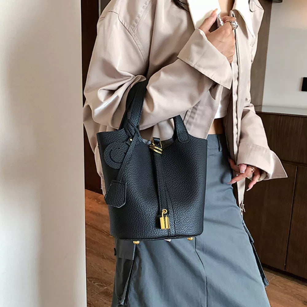 Bucket Crossbody Bag With Lock Detail in White, side view