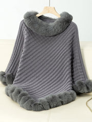 Dark gray knit poncho with faux fur trim on collar, cuffs, and hem