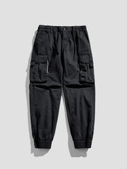 Black cargo joggers with flap pockets and elastic cuffs.