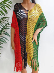 Colorblock crochet cover-up with fringe in red, black, yellow, and green.