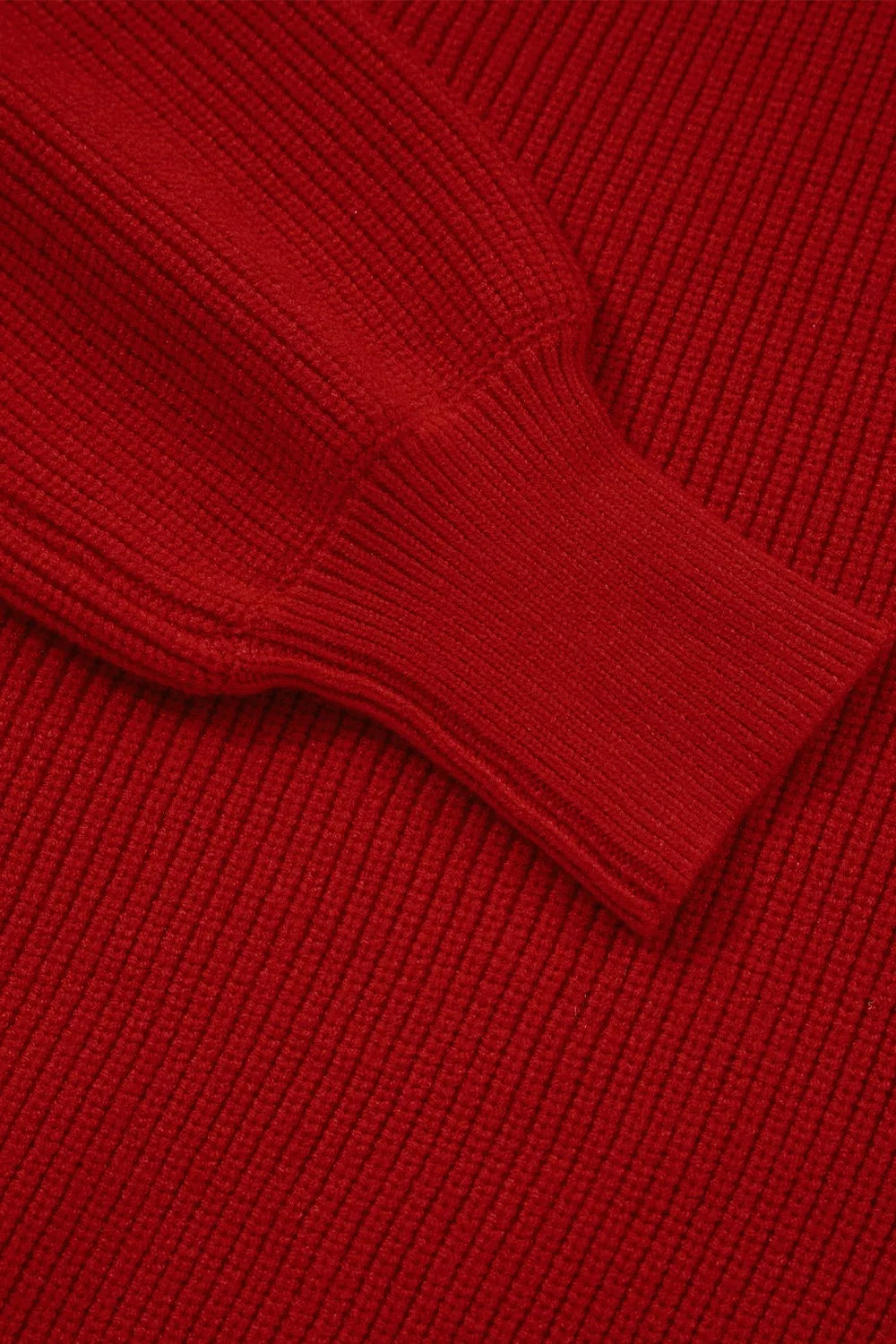 Red ribbed knit sweater with a backless bow detail