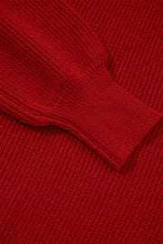 Red ribbed knit sweater with a backless bow detail