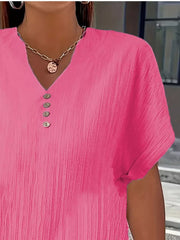 Textured rose red V-neck t-shirt with decorative buttons and short sleeves.