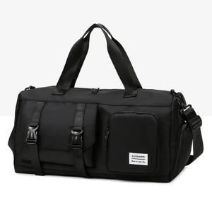 Black duffel bag with buckle details and multiple pockets, perfect for travel or gym.