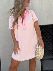 Pink short sleeve collared mini dress with frayed hem and satin trim.