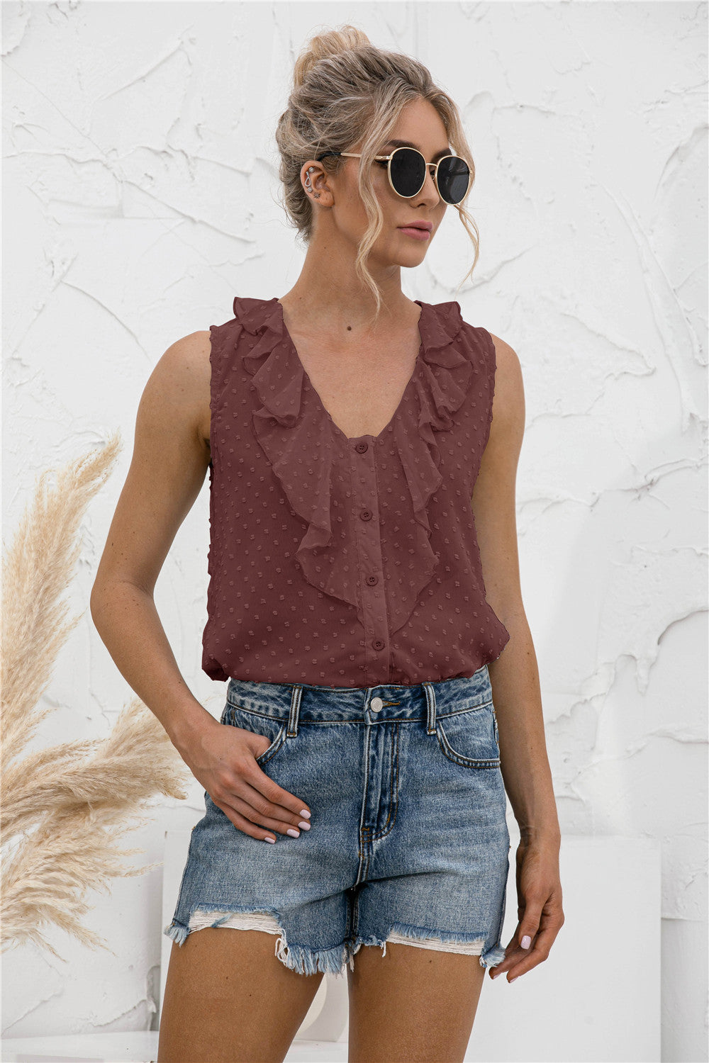 Brown textured ruffle front sleeveless blouse with button detail