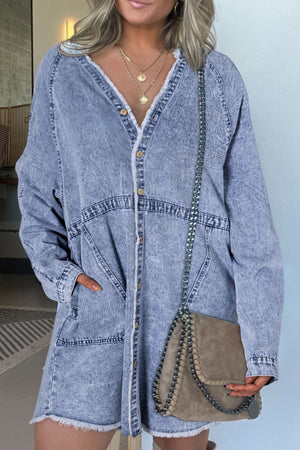 Acid wash denim shirtdress with raw hem, V-neck, button front, and long sleeves.