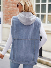 Light blue denim utility gilet with grey hood, buttoned front detail, and classic stitching.