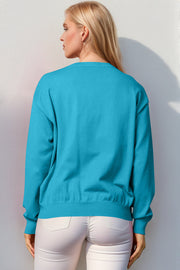 Cerulean crewneck sweater with ribbed cuffs and hem, acrylic knit.