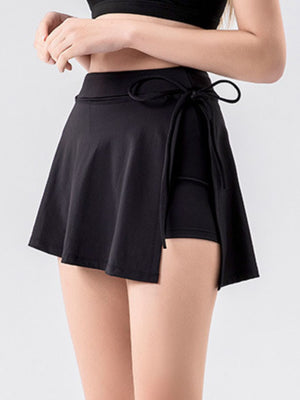 Black wrap-detail skort with side tie and built-in shorts.