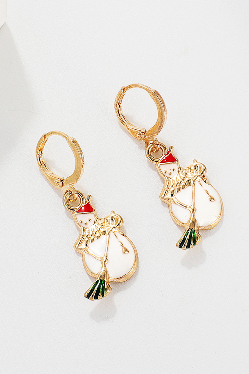 Festive Santa charm hoop earrings with white snowman and red hat, gold alloy.