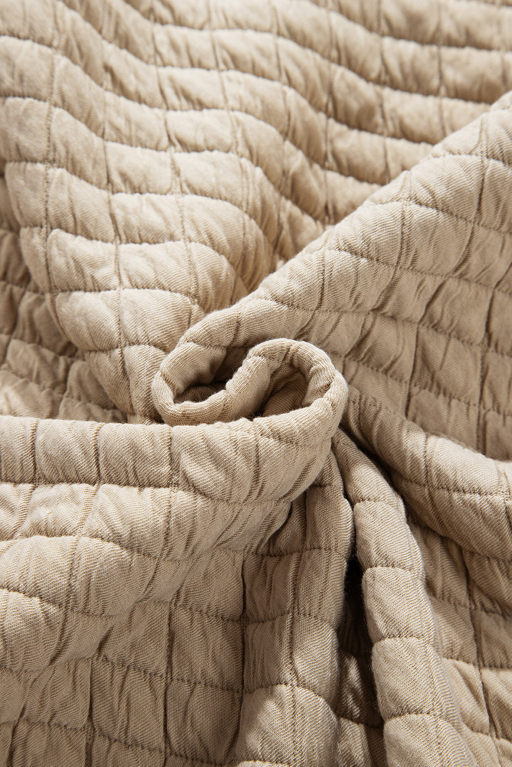 Beige diamond quilted oversized button-up jacket fabric detail
