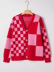 Checkerboard knit cardigan in red and pink with button front and V-neck.