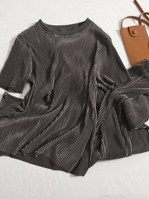 Dark Gray pleated two-piece set with short sleeves and a crew neck, styled with a brown crossbody bag.