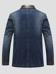 Men's denim blazer in blue with a leather collar and button cuffs.