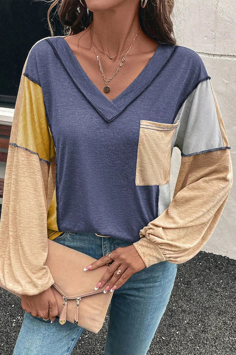 Contrast stitch v-neck t-shirt in dusty blue with colorblock sleeves and chest pocket.