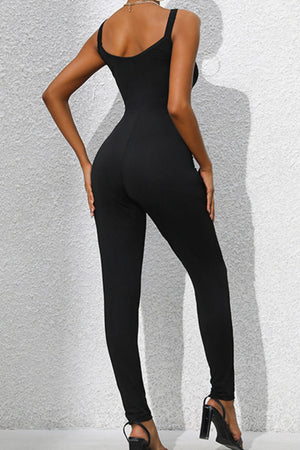 Black sculpted bodice chain-strap jumpsuit with a fitted silhouette and skinny legs.