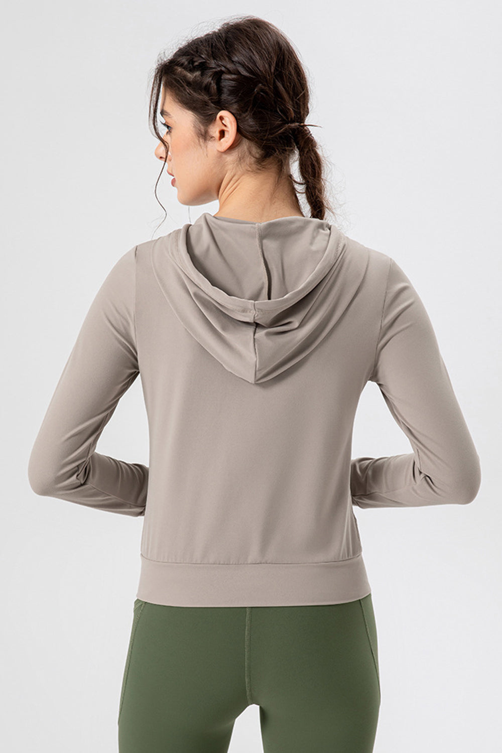 Tan activewear hoodie with long sleeves and a performance fit, shown from the back.