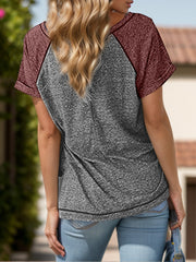 Raglan sleeve tee in gray with burgundy sleeves and button detail.