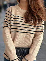 Tan ribbed knit crewneck sweater with black Breton stripes and crew neckline.