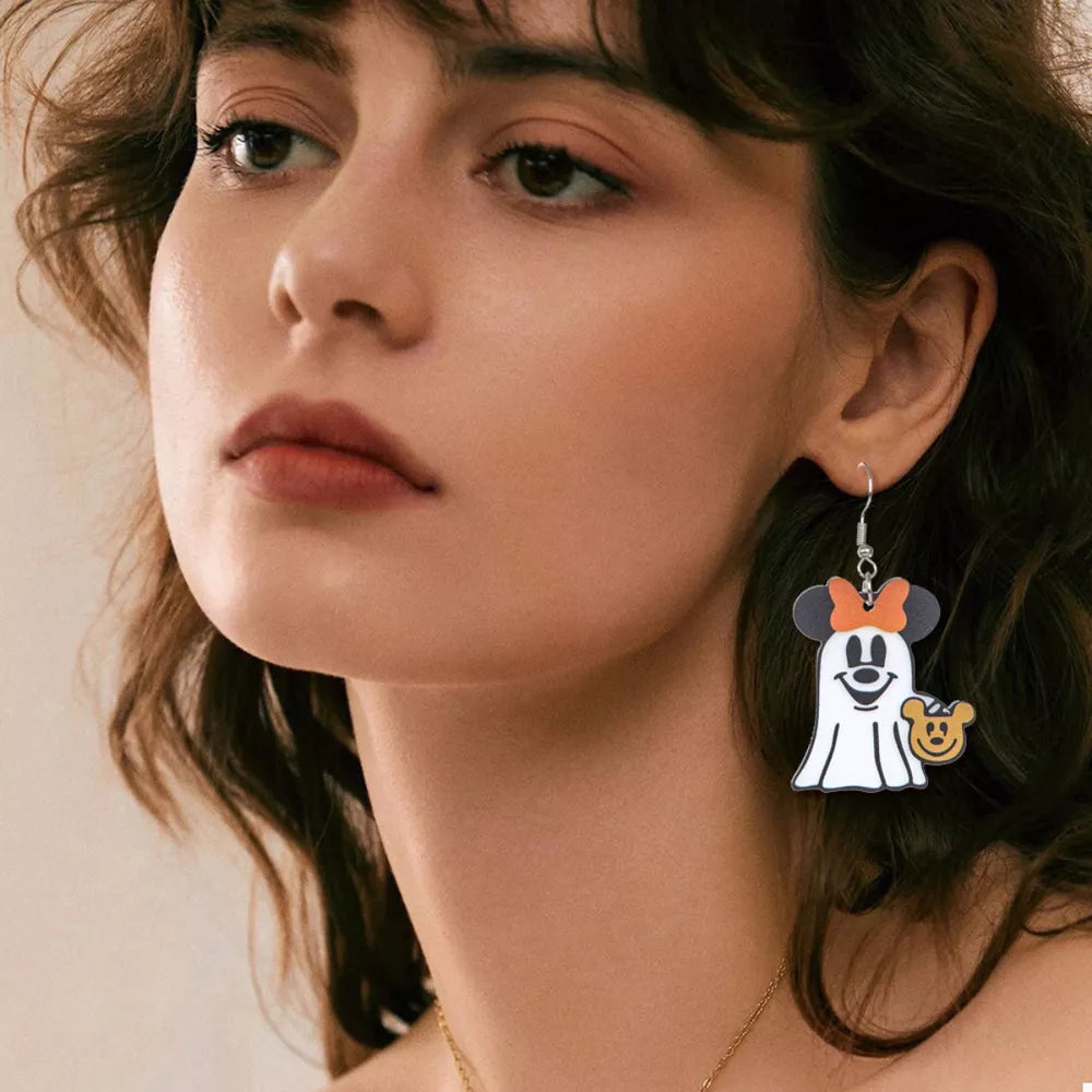 Charming Ghostly Mickey dangle earrings in black acrylic with orange bow, holding a small bear charm.