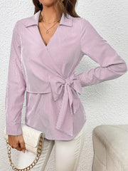 Wrap-front striped blouse in blush pink with a bow detail and collar.