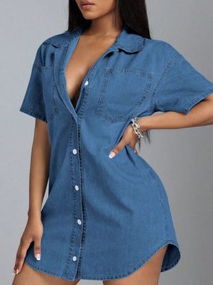 Medium wash denim oversized shirt dress with plunge neckline, short sleeves, and button front.