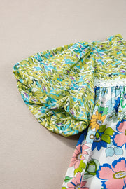 Floral patchwork blouse with puff sleeves and crochet trim, featuring lime and multi-color floral prints.
