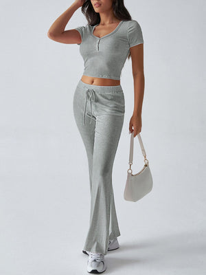 Light gray button-front crop top and flared lounge pants set with drawstring waist.