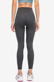 Dark gray StealthFit pocketed leggings with a V-seam detail on the back.